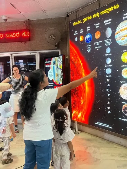 At the Jawaharlal Nehru Planetarium, our students learn about the solar system from a large, illuminated chart.