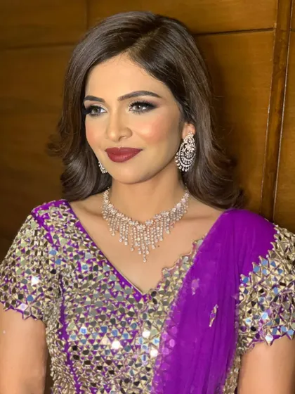 A sophisticated portrait showcasing the complete sangeet look. The makeup is bold but balanced, creating a look of pure elegance.