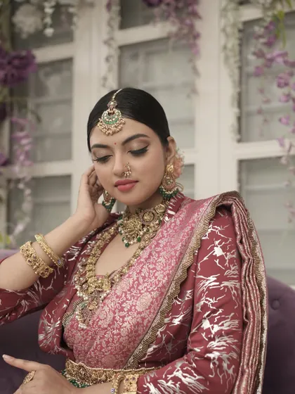 A candid, gentle moment from the shoot. The soft makeup looks beautiful even in a more relaxed and natural pose.