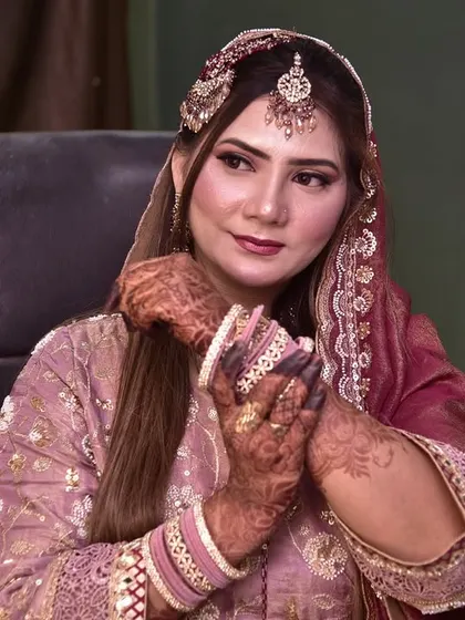 A candid moment of the engagement bride, looking thoughtful and beautiful as she gets ready for her special day.