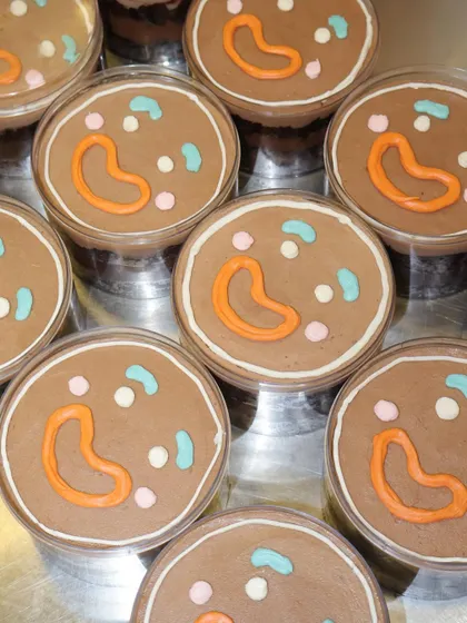 A tray full of our adorable gingerbread men chocolate mousse cups, ready for a Christmas party.