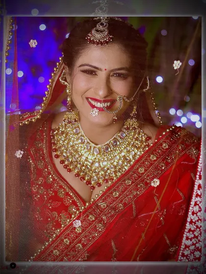 A radiant bride smiling for the camera, captured with beautiful lighting that highlights her happiness.
