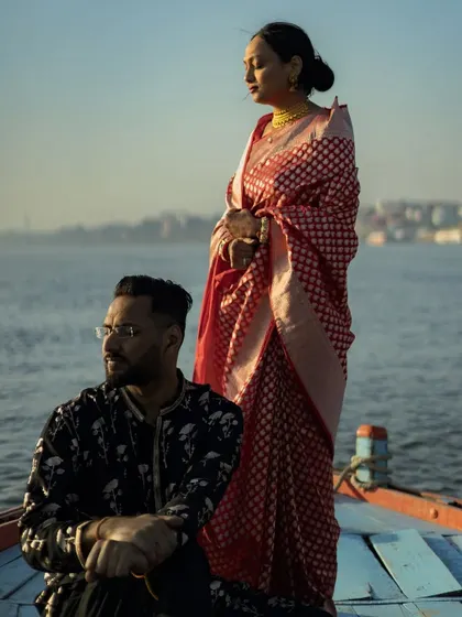 A stunning portrait of a couple on a boat in Varanasi. The serene water and the golden hour light create a breathtaking backdrop for this pre-wedding shoot.