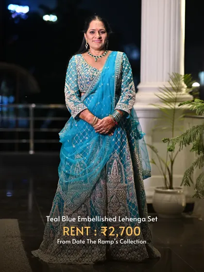 This teal blue embellished lehenga set is a unique and beautiful color choice for a wedding guest.