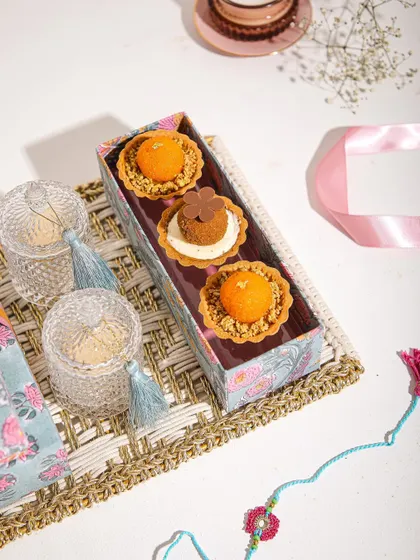 A box of our Mithai Tartlets, featuring Motichoor Ladoo and other festive flavours, ready for a celebration.