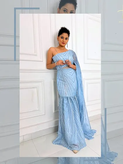 A relaxed pose in the ice-blue gown, showing how comfortable and stylish it is.