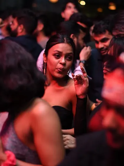 A close up on the crowd, showing the focus and enjoyment on their faces.