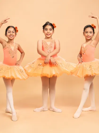 Our dancers are ready to grace the stage in 'The Waltz of the Flowers.' These photos capture their excitement and poise before bringing this timeless piece from The Nutcracker to life.