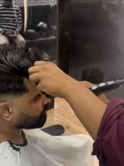 The styling process for the pompa-mullet, using a blow dryer for volume.