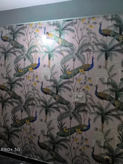 An elegant wallpaper featuring peacocks and palm trees, adding a touch of Indian royalty and nature.