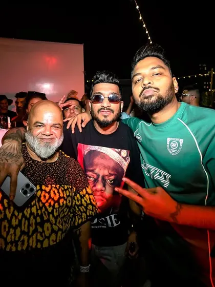 Posing with friends and fellow artists. The hip-hop community is tight-knit.