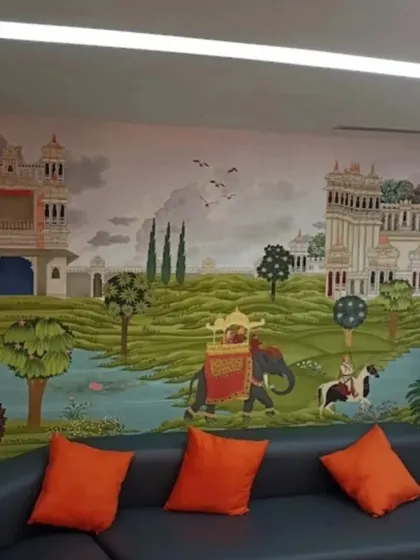 A custom heritage mural installed in an office waiting area. The design, featuring palaces and royal processions, provides a stunning visual experience for clients and reflects a brand that values culture and artistry.