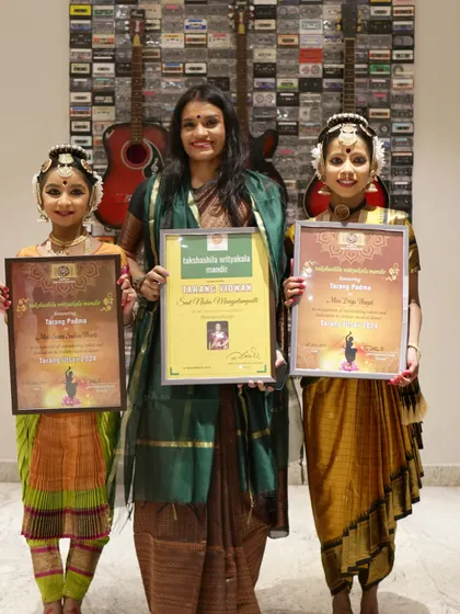 A proud moment with my students Priya and Saara after their excellent performances at Tarangutsava. I was also honored to receive the "Tarang Vidvan" award.
