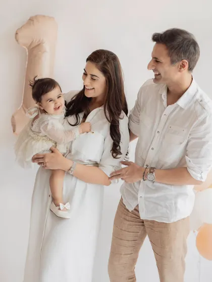 A candid moment of laughter during a first birthday family shoot. These unposed shots often become the most cherished memories.