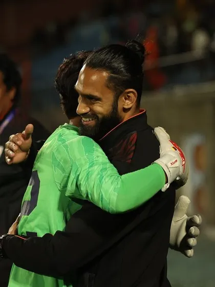 A hug with the goalkeeper after a successful championship run. These moments of connection and shared success are the most rewarding parts of coaching.