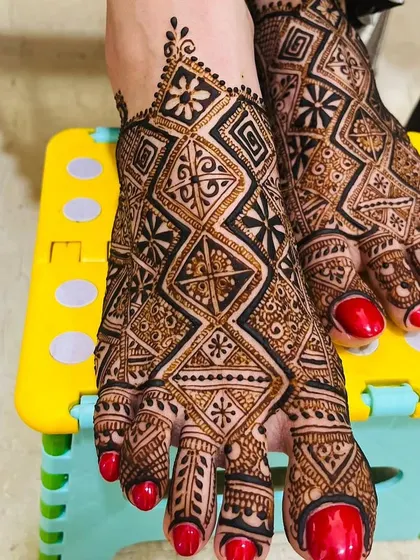 A bold, geometric pattern for the feet. The checkerboard design is modern yet traditional, and the red nail polish provides a beautiful contrast.