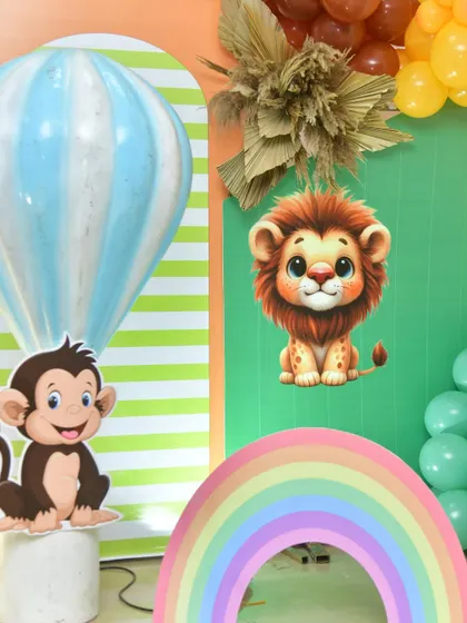 A collection of cute jungle animal cutouts and a rainbow prop, perfect for a photo corner.