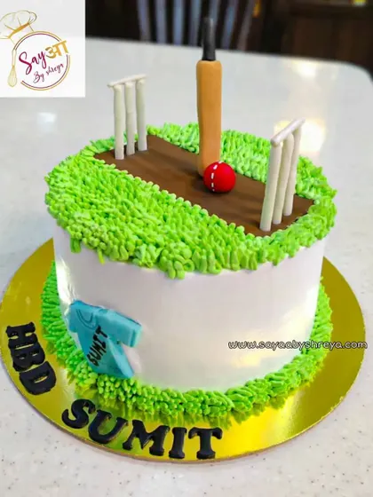 Another design for the fans of cricket. This one features a fondant cricket pitch on a bed of green buttercream grass, complete with a jersey, making it a great choice for any cricket-themed celebration.