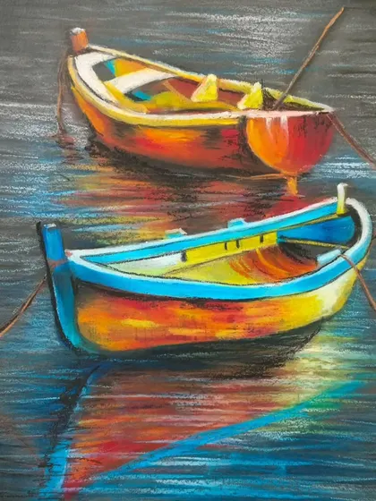A beautiful oil pastel drawing of colorful boats on water. Our classes explore how to use oil pastels to create vibrant, painterly effects and reflections.