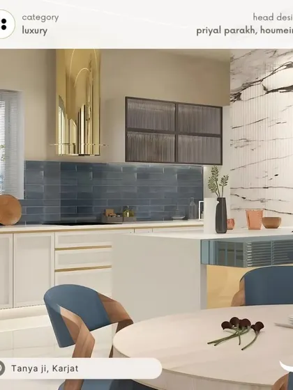 Here's a luxury kitchen design featuring a stunning gold chimney as the centerpiece. The combination of deep blue subway tiles, white cabinets, and a marble-patterned wall creates a high-end, dramatic look. The island with an attached dining table makes it a perfect space for both cooking and entertaining.