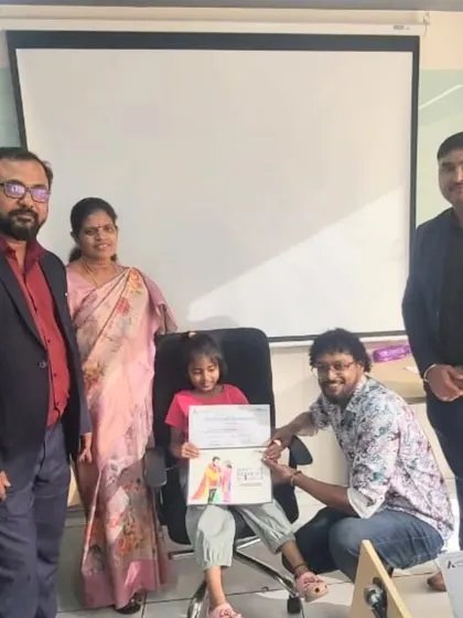 One of our talented winners receiving her prize for the coloring competition. We love celebrating the artistic achievements of our students alongside their families.