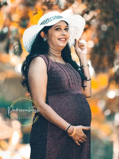A happy and bright shot from the maternity session. The makeup is light and fresh, perfect for an outdoor photoshoot, ensuring the mommy-to-be looks and feels her best.
