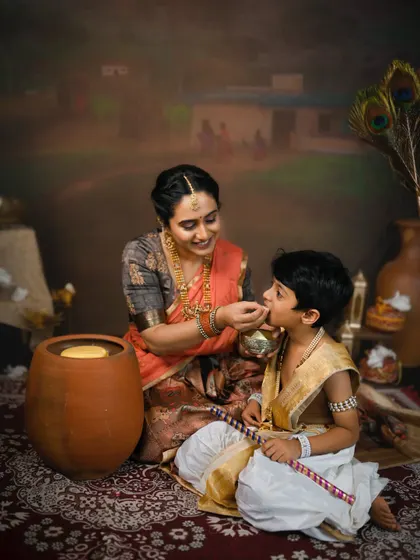 Another sweet moment of a mother feeding her son during their traditional photoshoot. These are memories they will both cherish.