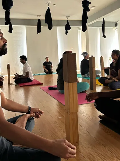 Students using blocks for Trataka (candle gazing), a powerful meditation technique to improve focus.
