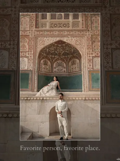 A majestic shot at Amer Fort in Jaipur, where the couple is framed by the intricate, historic architecture, showcasing the grandeur of a royal-themed pre-wedding shoot.