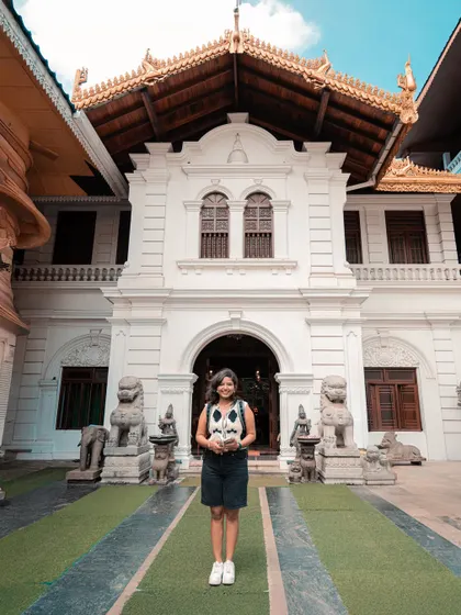 Standing in front of a beautiful white temple building in Colombo. The architecture here is a stunning blend of different cultural influences.