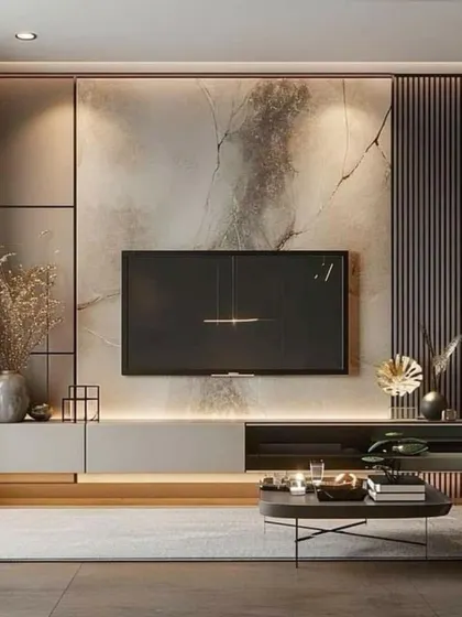 A darker, more dramatic take on the TV wall. This design uses a moody, abstract marble panel with integrated backlighting and asymmetrical shelving for a bold, contemporary feel.