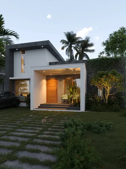 A compact home in Ernakulam with a clean, modern design. The facade features a living green wall, adding a vibrant natural element to the structure.