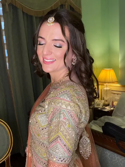 A side profile showing off the soft curls and the beautiful, subtle makeup. It’s all about enhancing, not overpowering.