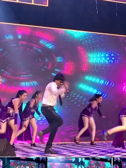 Another angle of our dynamic performance in Surat. The colorful LED background and energetic dance moves create a vibrant spectacle.