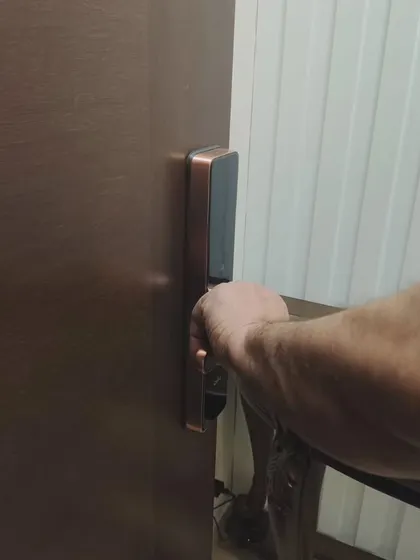 The mechanical key provides a reliable backup entry method. This image shows how easily the physical key can be used if needed.