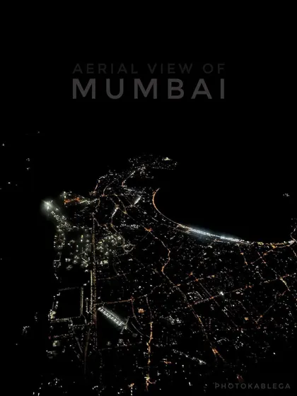 Mumbai transforms at night, and this is its electric pulse seen from above. This aerial night shot captures the iconic Queen's Necklace and the city's grid of lights. Capturing clear, detailed nightscapes requires specialized drone equipment and piloting skills to manage low-light conditions.