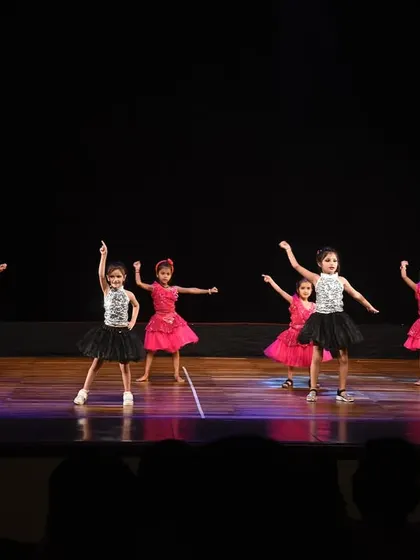 Our little dancers in pink and black tutus, filling the stage with grace and energy during their Bollywood performance.