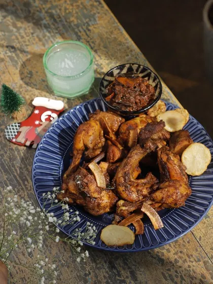 A beautifully plated Kuttanad Duck Roast, garnished with fried coconut slivers. This dish captures the essence of festive comfort and heritage, making any Christmas celebration extraordinary.