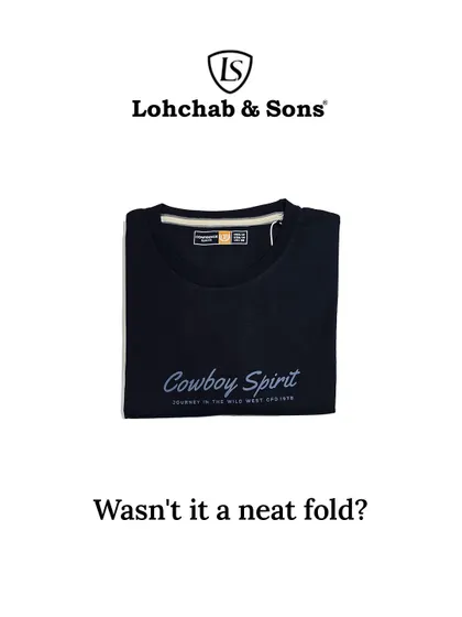 A closer look at the front of our 'Cowboy Spirit' tee, neatly folded to showcase the elegant script logo. This highlights the quality and care we put into every single item in our store.