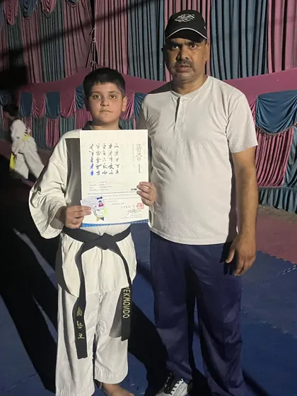 A proud moment for our new black belt holder, Shivansh Tyagi, as he receives his official certificate.