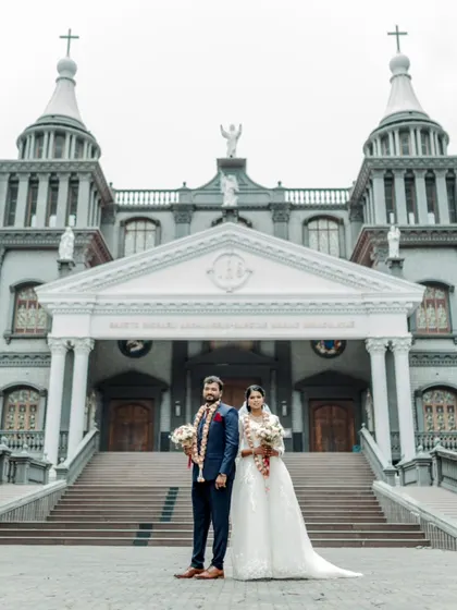 A timeless portrait of a couple after their Christian wedding ceremony in Udupi. I work to frame these moments against grand architectural backdrops to create truly epic and memorable wedding photographs.