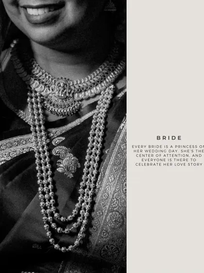 A black and white detail shot of a bride's traditional temple jewelry. This focuses on the craftsmanship and cultural significance of the wedding attire.