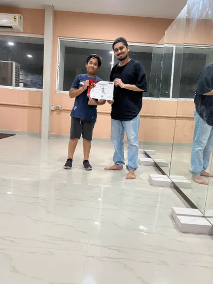 Students from my kids' batch receiving their certificates. I offer certification to validate the hard work and dedication they put into their training.