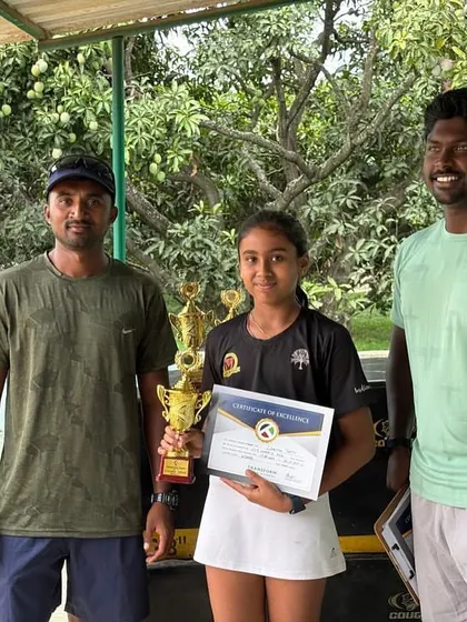 Linesha Shetty with her coaches after her CS7 U-12 singles title win. The strong bond between our coaches and players is key to their development and success.