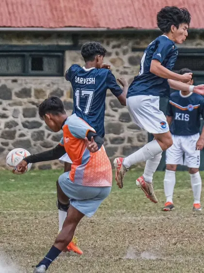An intense mid-air challenge for the ball during the Soccer Kodai Open 2024. Our teams compete with grit and determination in every match.