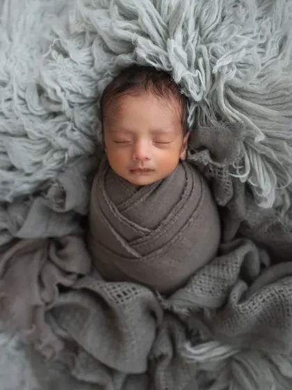 The other twin sister, also wrapped in a complementary shade of grey. She looks so serene and beautiful.