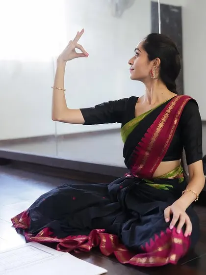 This is us. A candid moment of teaching in the studio, with the reflection in the mirror showing the student-teacher connection.