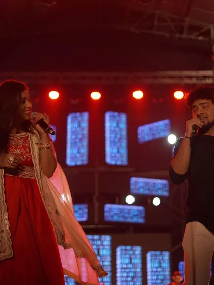 Shreya Ghoshal performing a duet, highlighting the full band experience we provide for our live concerts.
