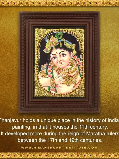 A framed Tanjore painting of Lord Krishna. This art form, originating in the 11th century, is a cherished part of our curriculum on classical Indian arts.