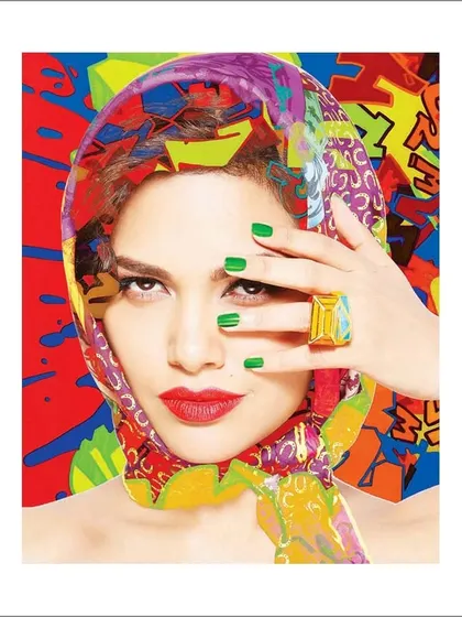 A vibrant collaboration with the art of James Gill, featuring Esha Gupta. Her portrait is merged with a colorful, pop-art background, creating a dynamic collage that blends photography and graphic art.